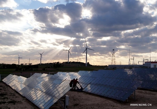 File photo taken on June 12, 2012 shows a scene of the Xiaowutai Photovoltaic Plant in Youyu County, north China's Shanxi Province. According to the latest data released by the State Energy Administration, China has become the world's largest energy producer by the end of 2012. The total installed electricity capacity was 1.14 billion kilowatts, including 249 million of hydropower capacity which was the world's largest. The installed wind power capacity stood at 63 million kilowatts, making China the world's No. 1 in this field. The nuclear power under construction is also the world's largest. (Xinhua/Yan Yan)&nbsp; 