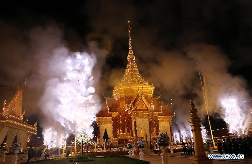Smoke rises from the cremation site of late Cambodian King Father Norodom Sihanouk in Phnom Penh, Cambodia, Feb. 4, 2013. Cambodia began to cremate the body of the country's most revered King Father Norodom Sihanouk on Monday evening after it had been lying in state for more than three months at the capital's royal palace. (Xinhua/Yao Dawei) 
