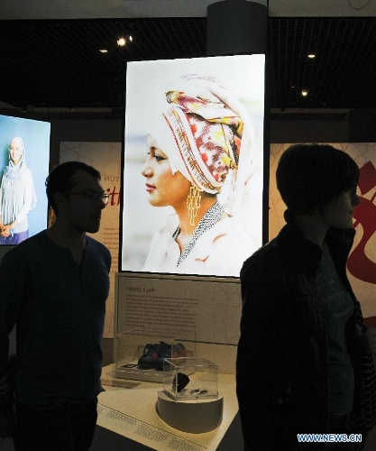 People visit the creation at the Muslim women's fashion exhibition held in Sydney, Australia, April 24, 2013. The exhibition displayed works of Australian designers' new generation. (Xinhua/Jin Linpeng) 