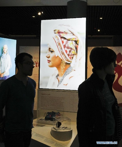 People visit the creation at the Muslim women's fashion exhibition held in Sydney, Australia, April 24, 2013. The exhibition displayed works of Australian designers' new generation. (Xinhua/Jin Linpeng) 