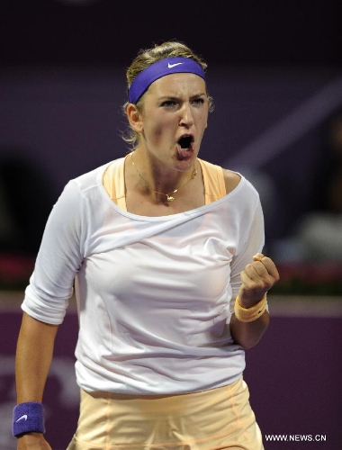 Victoria Azarenka of Belarus jubilates after defeating Agnieszka Radwanska of Poland during their women's semifinal at the Qatar Open tennis tournament in Doha, capital of Qatar, Feb. 16, 2013. Azarenka won 2-0. (Xinhua/Chen Shaojin) 