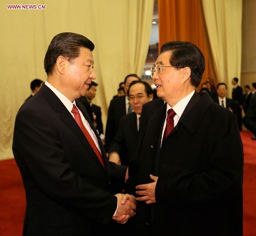  Hu Jintao (R) talks with Xi Jinping after the fourth plenary meeting of the first session of the 12th National People's Congress (NPC) in Beijing, capital of China, March 14, 2013. Xi was elected president of the People's Republic of China (PRC) and chairman of the Central Military Commission of the PRC at the NPC session here on Thursday. (Xinhua/Lan Hongguang)