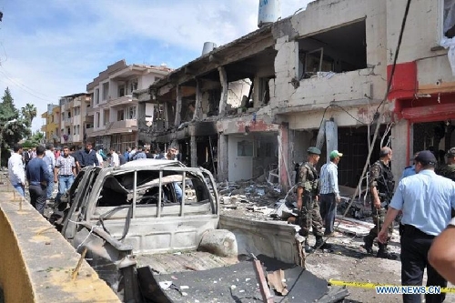 Photo taken on May 11, 2013 shows the site of an explosion in the town of Reyhanli, in the southern Turkish province of Hatay. At least 40 people were killed and 100 others injured after explosions shook a Turkish town on Saturday near the border with Syria, Turkish Interior Minister Muammer Guler said. (Xinhua/NTV) 