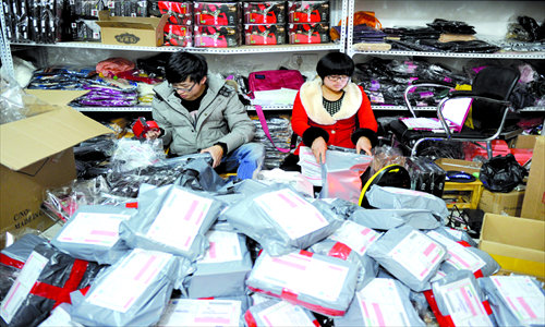 Students package their products to be delivered to customers. Photo: CFP