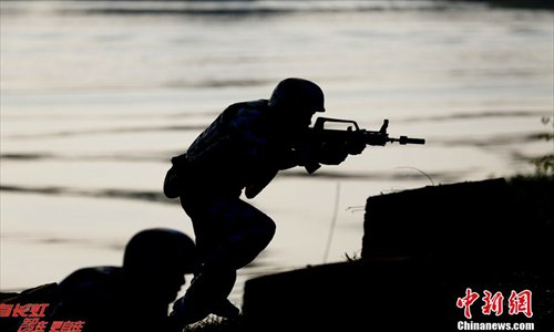 Chinese marines soldiers attend an exercise during a marines landing drill at their base in Zhanjiang, Guangdong province, December 23, 2012. The Marine Corps under the PLA Navy's South China Sea Fleet kicked off the tactical exercise of the landing drill at their base in Zhanjiang, Guangdong province. Source: Chinanews.com