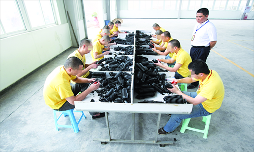 People doing manual labor at the Chongqing Drug Rehabilitation Center, on June 23, 2010. Photo: CFP