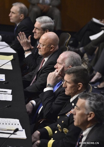 (up to down) National Counterterrorism Center Director Matthew Olsen, FBI Director Robert Mueller, Director of National Intelligence James Clapper, CIA Director John Brennan, Defense Intelligence Agency Director Michael Flynn, and Assistant Secretary of State for Intelligence and Research Philip Goldberg, testify before the Senate Select Intelligence Committee during a hearing on 