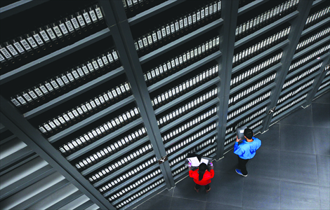 Visitors read archives of the massacre victims inside the hall. Photo: Cai Xianmin/GT