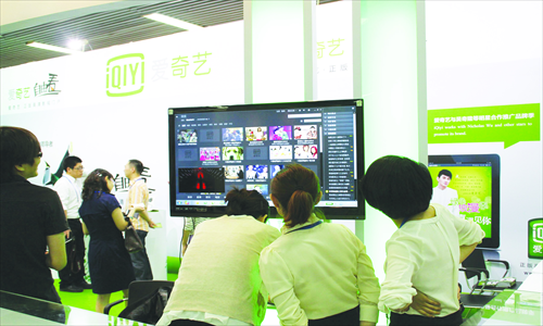 People look at a video website at an international copyright expo in Beijing in June this year. Photo: CFP