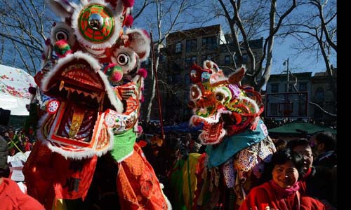 People perform dragon dance to celebrate the Chinese Lunar New Year in Chinatown, in downtown Manhattan of New York City on Feb. 10, 2013. Photo: Xinhua