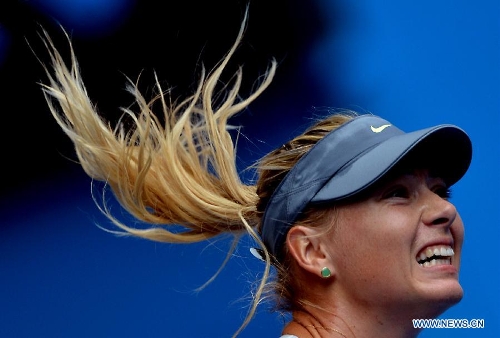 Maria Sharapova of Russia reacts during the first round women's singles match against her compatriot Olga Puchkova on the first day of 2013 Australian Open tennis tournament in Melbourne, Australia, Jan. 14, 2013. Maria Sharapova won 2-0 to enter the next round. (Xinhua/Chen Xiaowei) 