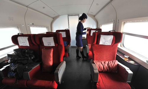 Photo taken on December 22, 2012 shows a sightseeing compartment on G83 express train during a trial trip for journalists from Beijing, capital of China. China is set to open the world's longest high-speed railway on December 26, linking Beijing and the southern economic center of Guangzhou. Running at an average speed of 300 km per hour, the 2,298-km Beijing-Guangzhou high-speed railway will cut travel time between the two cities to about 8 hours. Designed with a maximum speed of 350 km per hour, the railway has 35 stops in major cities, including Shijiazhuang, capital of north China's Hebei Province, Zhengzhou, capital of central China's Henan Province, Wuhan, capital of central China's Hubei Province and Changsha, capital of central China's Hunan Province. Photo: Xinhua 