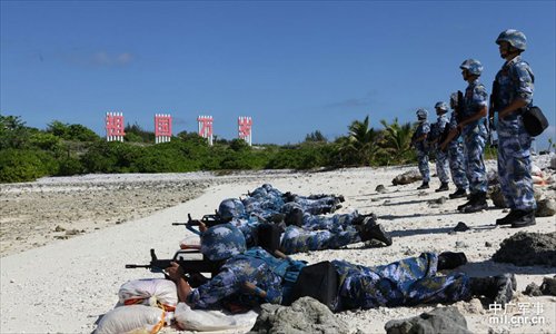 Soldiers shoot floating balloons in the sea as part of a military training competition held by the PLA on the Xisha Islands December 5. Photo: mil.cnr.cn