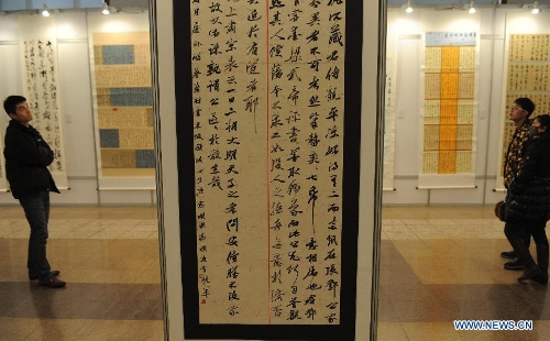 Visitors view calligraphy works at the Hebei Province Museum in Shijiazhuang, capital of north China's Hebei Province, Jan. 20, 2013. Over 160 works were displayed at a running script calligraphy exhibition, which kicked off on Sunday. (Xinhua/Wang Xiao) 