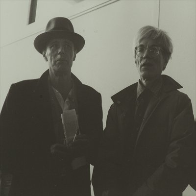 Beuys (left) photographed with Warhol in 1980.