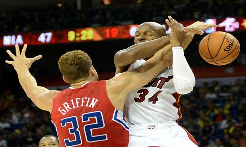 Blake Griffin of the Los Angeles Clippers (No.32) blocks Ray Allen of the Miami Heat. Photo: AFP