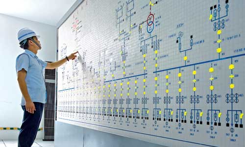 A man checks readings in the control room of the Qingcaosha reservoir.
