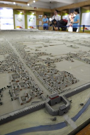 A miniature wooden model of Beijing made in the 1950s at the Beijing City Construction Archives in Xicheng district Wednesday. It is the best preserved example of a wooden city model nationwide. Photo: Li Hao/GT