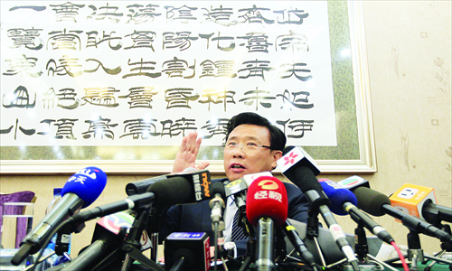 Sany Chairman Liang Wengen answers questions from the media in Beijing on November 11. Photos: CFP
