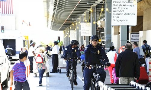 Police patrol on bikes as part of security efforts at the Los Angeles International Airport Tuesday. Photo: Mao Jianjun