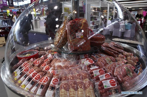 Photo taken on Jan. 30, 2013 shows meat products displayed at the International Hospitality and Food Service Fair (SIRHA) in Lyon, France. The five-day fair was closed on Wednesday. The biyearly SIRHA was founded in 1984 and is considered one of the most influential food expos in Europe. (Xinhua/Gao Jing)