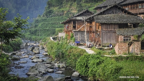 Photo taken on June 21, 2013 shows the Dimen Dong minority village in the morning in Liping County of southwest China's Guizhou Province. Dimen is a Dong minority village with about 2,500 villagers. It is protected properly and all the villagers could enjoy their peaceful and quiet rural life as they did in the past over 700 years. (Xinhua/Ou Dongqu)