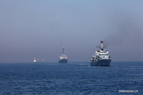 Naval ships from various countries are seen during the AMAN-13 exercise in the Arabian Sea, March 7, 2013. Naval ships from 14 countries, including China, the United States, Britain and Pakistan, joined a five-day naval drill in the Arabian Sea from March 4, involving 24 ships, 25 helicopters, and special forces. (Xinhua/Rao Rao) 