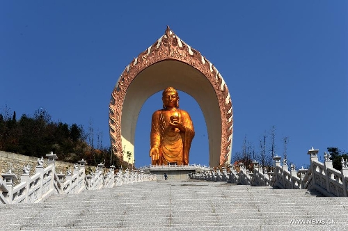 The Donglin Buddha statue is seen at the Donglin Temple in Xingzi County of Jiujiang City, east China's Jiangxi Province, March 6, 2013. The bronze statue of Amitabha Buddha, which is 48 meters in height, is believed to be the tallest of its kind in the world. The project, with the total cost of about 1 billion yuan (161 million U.S. dollars), has been basically completed. It was totally funded by private donations. (Xinhua/Song Zhenping)  
