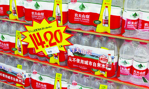 Nongfu Spring mineral water is displayed at a supermarket in East China's Jiangsu Province, with a notice saying that it never contains tap water. Photo: CFP