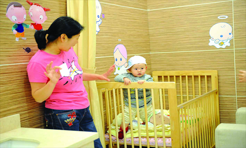 Times aren't easy for moms. Breast-feeding has been heralded as vital for a child's development, but there are few places for women to do so outside the home. Photo: CFP