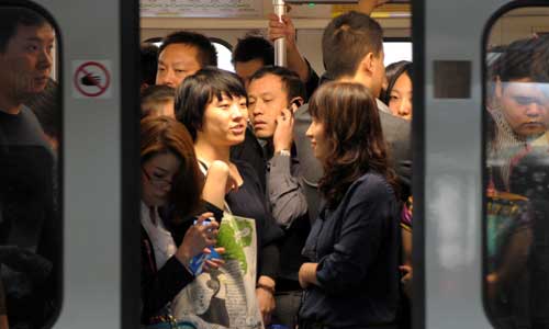 A crowded carriage during rush hour.