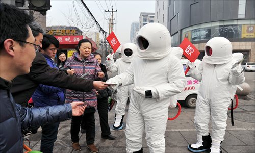 Men dressed as astronauts in Taiyuan, Shanxi Province hand out masks to passersby as the city continues to be blighted by severe air pollution. Photo: CFP