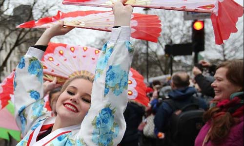 People take part in a parade celebrating the Chinese Lunar New Year in London, Britain, on Feb. 10, 2013. Photo: Xinhua