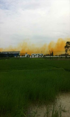 Yellow smoke rises from the factory of the Dongfang Plating Company in Yueqing in March. Photo: CFP