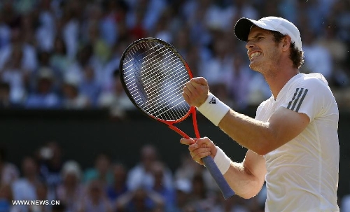Andy Murray of Britain celebrates during the men's singles final with Novak Djokovic of Serbia on day 13 of the Wimbledon Lawn Tennis Championships at the All England Lawn Tennis and Croquet Club in London, Britain, July 7, 2013. Andy Murray on Sunday won his first Wimbledon title and ended Britain's 77-year wait for a men's champion with a 6-4 7-5 6-4 victory over world number one Novak Djokovic. (Xinhua/Wang Lili) 