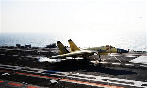 Photo shows carrier-borne J-15 fighter jet lands on China's first aircraft carrier, the Liaoning.  Photo: mil. cnr.cn