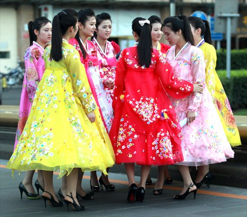 Newly hired North Korean hostesses, working at a North Korean restaurant, take an afternoon off to see their new neighborhood in Beijing. Photo: CFP