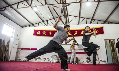 Most people carrying on the Five Tiger Stick tradition are men in their 20s and 30s without jobs. Photo: Li Hao/GT