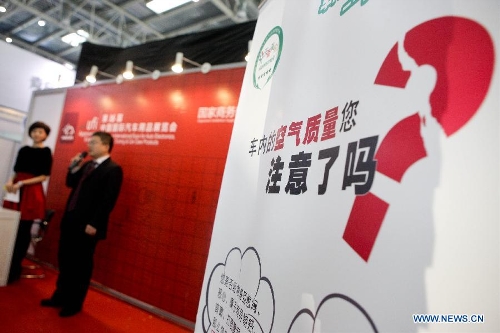 An exhibitor introduces products for removing air pollution inside vehicles at the 16th China International Expo for Auto Electronics, Accessories, Tuning & Car Care Products (CIAACE 2013) in Beijing, capital of China, March 3, 2013. The four-day CIAACE 2013 kicked off on March 1 in Beijing. (Xinhua/Zheng Huansong)  