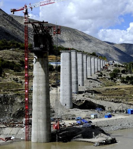 The railway linking Lhasa and Xigaze is under construction in Southwest China's Tibet Autonomous Region, September 21, 2012. The railway runs 253 kilometers with a designed transportation capacity of more than 8.3 million tonnes every year. The construction work started in 2010 and it is estimated to finish in 2014. Photo: Xinhua