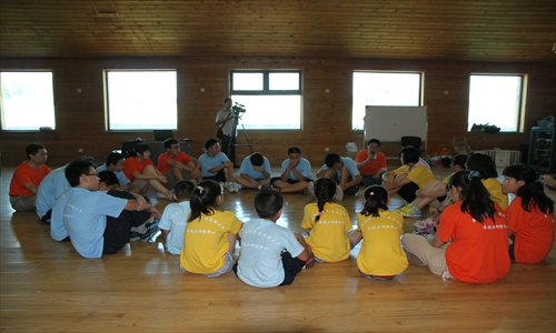 Youths participate in a group activity at an anti-frustration camp in Huairou district on August 9.  Photo: Courtesy of Ding Qi 

