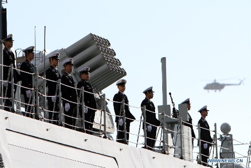 Chinese naval soldiers stand on the frigate at the habour of Algiers, Algeria, on April 2, 2013. The 13th naval escort squad, sent by the Chinese People's Liberation Army (PLA) Navy, arrived at Algiers of Algeria on Tuesday for a four-day visit after finishing its escort missions. (Xinhua/Mohamed Kadri) 