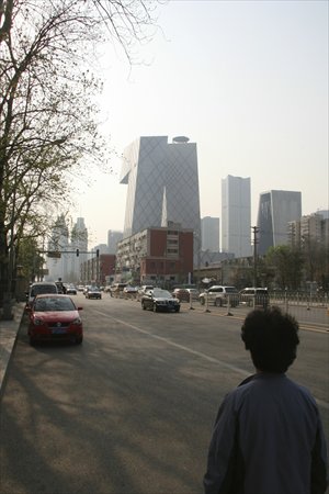 A woman walks near the CBD area in eastern Beijing. Photo: Peter C. Espina/GT