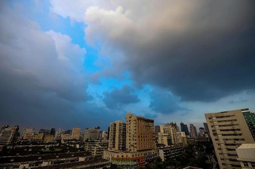 Clouds gather over the city as a warning of the coming typhoon in Hangzhou, capital of East China's Zhejiang Province, August 6, 2012. Typhoon Haikui, the 11th tropical storm of the year, is approaching Zhejiang Province and expected to land from Zhejiang's mid-north coast on Tuesday night and Wednesday morning. The local meteorological authority has issued a yellow alert against the typhoon early Monday. Photo: Xinhua