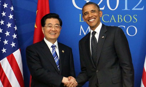 Chinese President Hu Jintao (L) meets with US President Barack Obama in Los Cabos, Mexico, June 19, 2012. Photo: Xinhua