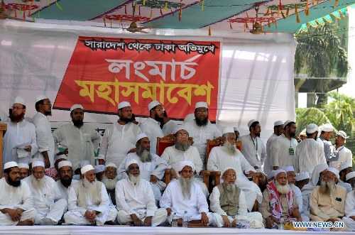 Hefazat-e-Islam top leaders sit on a stage during a grand rally at Motijheel area in Dhaka, Bangladesh, April 6, 2013. Tens of thousands of Islamists under the banner of Hefazat-e-Islam from across Bangladesh poured into the key commercial hub of the capital city to join a grand rally, demanding action against the 