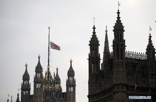 The Union Flag flies at half mast over the Houses of Parliament following the death of former British Prime Minister Baroness Margaret Thatcher in London, Britain, on April 8, 2013. It has been confirmed that Lady Thatcher died this morning following a stroke at the age of 87. (Xinhua/Wang Lili) 