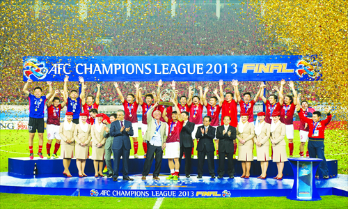 Guangzhou Evergrande players celebrate after winning the 2013 Asian Champions League final in Guangzhou on Saturday. Photo: CFP