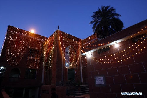 An illuminated building is seen during celebrations ahead of Eid-e-Milad-un-Nabi, marking the birth anniversary of the Islam's Prophet Mohammed, in northwest Pakistan's Peshawar on Jan. 24, 2013. (Xinhua Photo/Umar Qayyum) 
