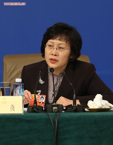 Zhen Zhen, a member of the 12th National Committee of the Chinese People's Political Consultative Conference (CPPCC), speaks at a press conference held by the first session of the 12th CPPCC National Committee in Beijing, capital of China, March 8, 2013. Invited CPPCC members answered questions on improvements in political consultative system at the press conference. (Xinhua/Wang Shen)